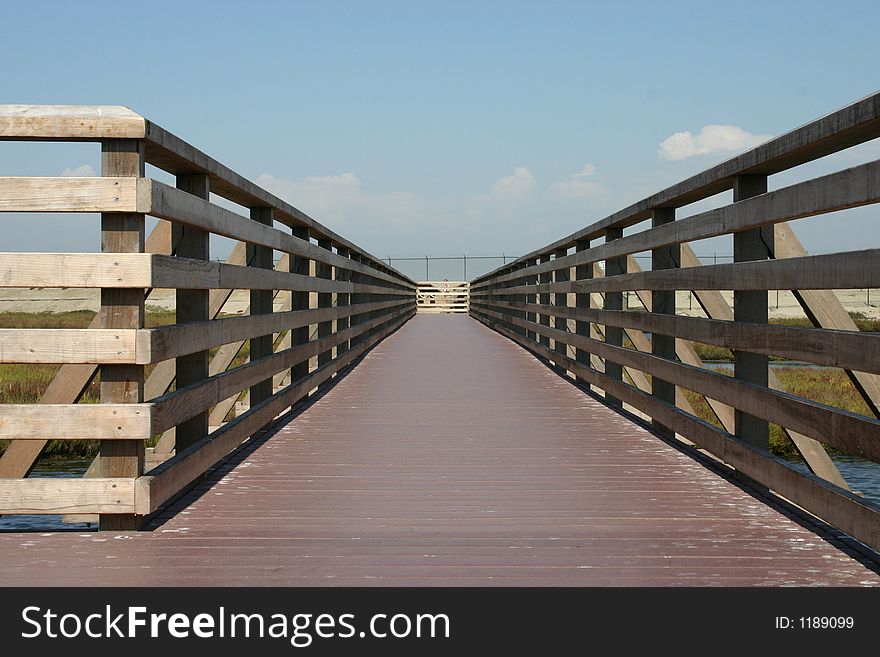 A wooden walkway at the Bolsa Chica Wetlands. A wooden walkway at the Bolsa Chica Wetlands