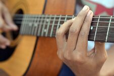 Practicing In Playing Bass Guitar. Close Up Of Man Hand Playing Bass Guitar. Royalty Free Stock Images