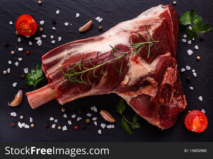 Fresh lamb meat on a textured stone plate