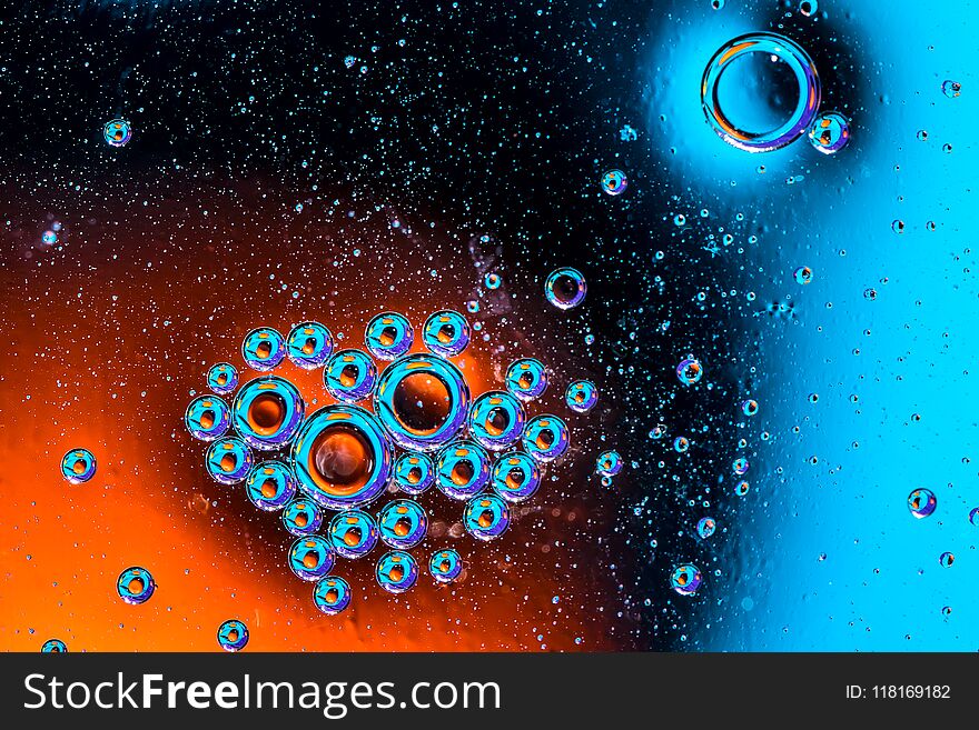 Macro Shot Of Oil Bubbles With Water On Colorful Background. Space And Universe Planets Styled Abstract Image