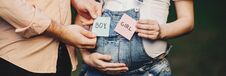 Baby Gender. Mom And Dad With BOY And GIRL Cards Stock Image