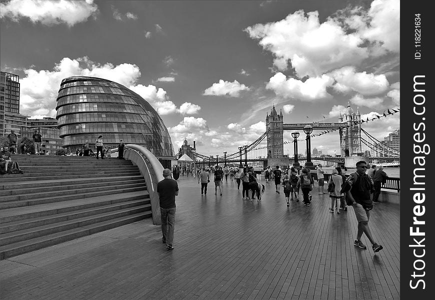 Grayscale Photo of People Walking Near Tower Bridge at London