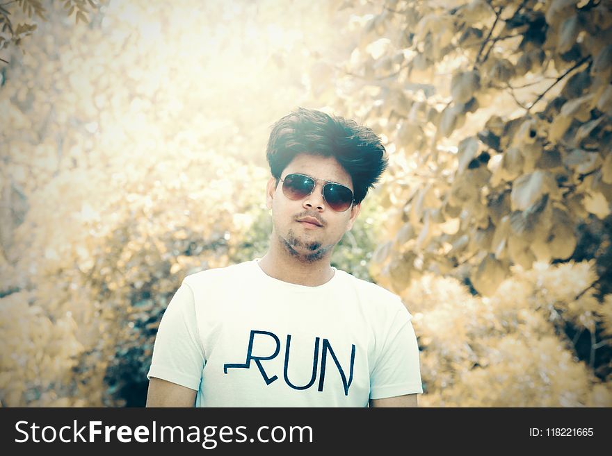 Man in White Crew-neck T-shirt With Sunglasses