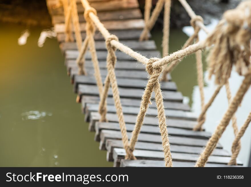 A large rope that tied the knot made a bridge for people to cross. And for adventure. A large rope that tied the knot made a bridge for people to cross. And for adventure