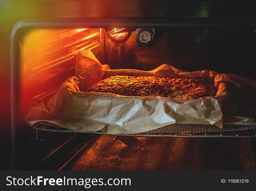 A Delicious Pie With A Variety Of Filling On A Baking Tray Is Baked In The Oven