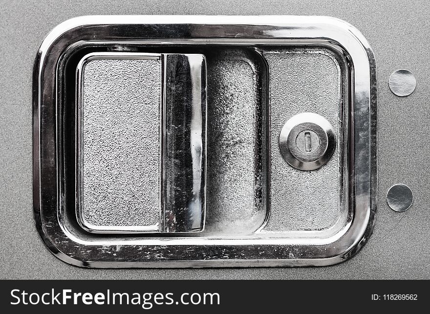 Close up of exterior chrome semi truck door handle.