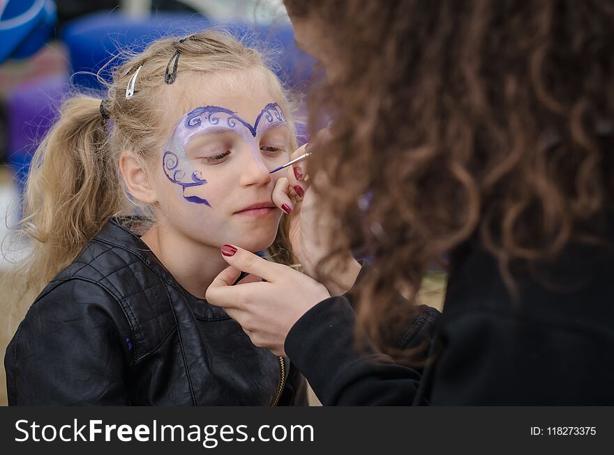 Adorable blond girl with face painting portrait. Adorable blond girl with face painting portrait