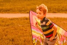 Little Boy Running With Kite In The Field On Summer Day In The Park Stock Photography