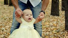 Young Father For A Walk In A Autumn Park With Baby Royalty Free Stock Photos