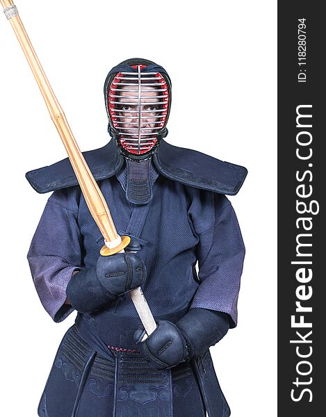 Swordsman in attacking position and protective equipment `bogu` and bamboo sword `sinai` for Japanese fencing Kendo training close-up