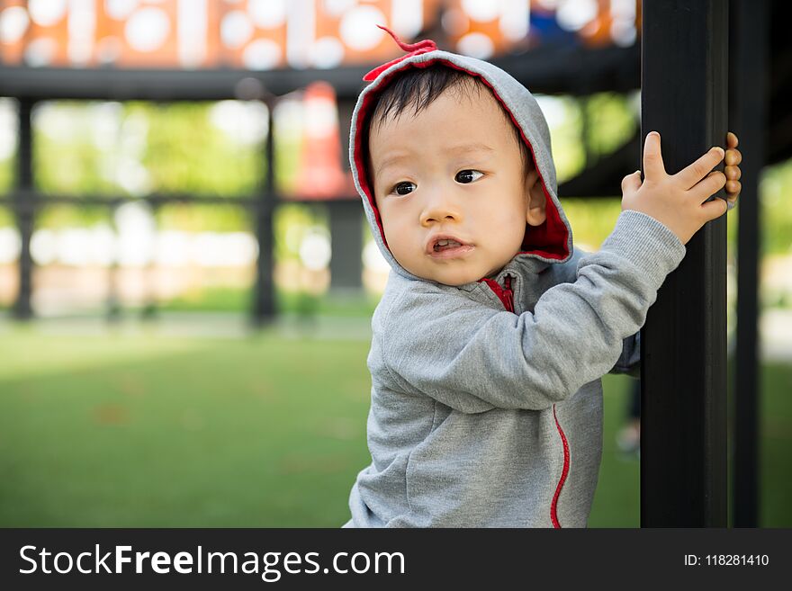 Portrait of little Asian baby boy at outdoor park