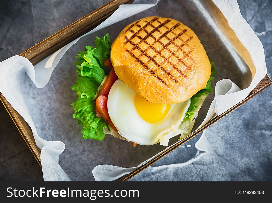 Hamburgers With Egg, Lettuce And Salmon Fish. Tasty Food