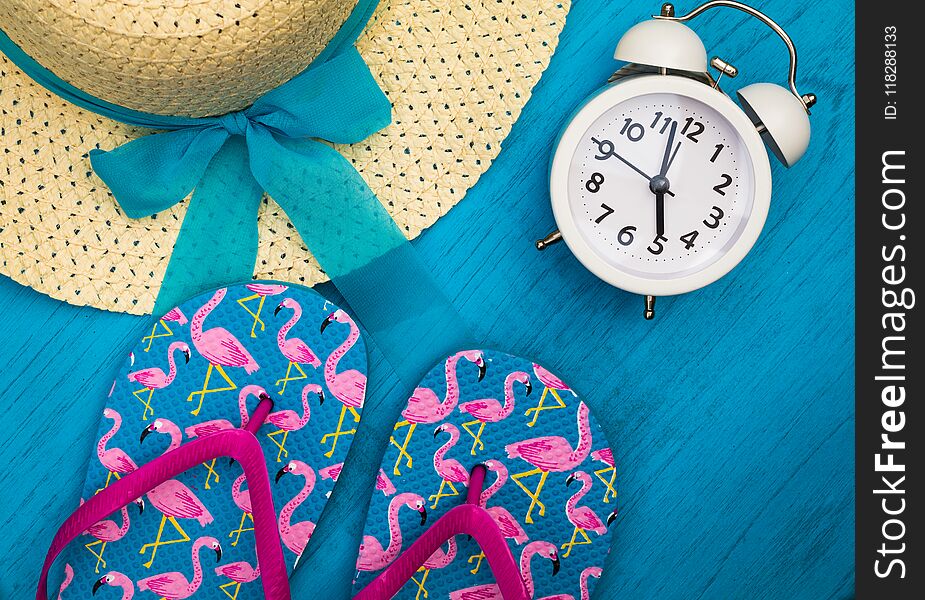 Vacation and Travel still life concept in bright colors and blue board, flat lay in vintage tones. Warm weather beach resort vacation holiday objects.
