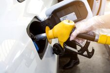 Woman Hand Refilling And Pumping Gasoline Oil The Car With Fuel At He Refuel Station In Europe Royalty Free Stock Photos