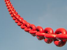 Red Chain Link Into The Sky. Stock Photography