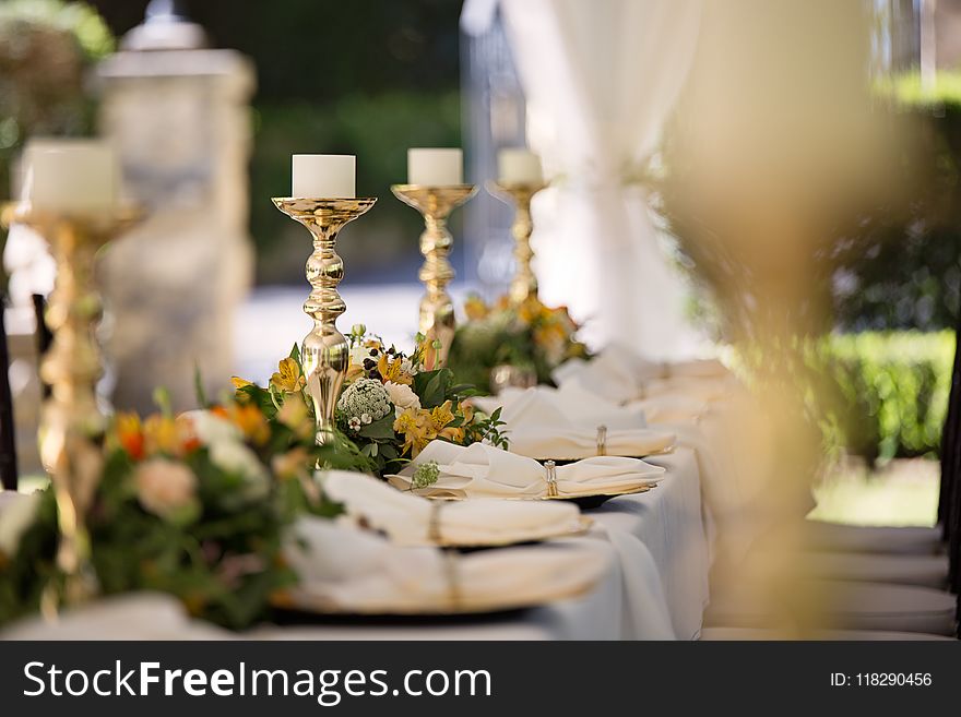 Selective Focus of Candlesticks on Table With Wedding Set-up