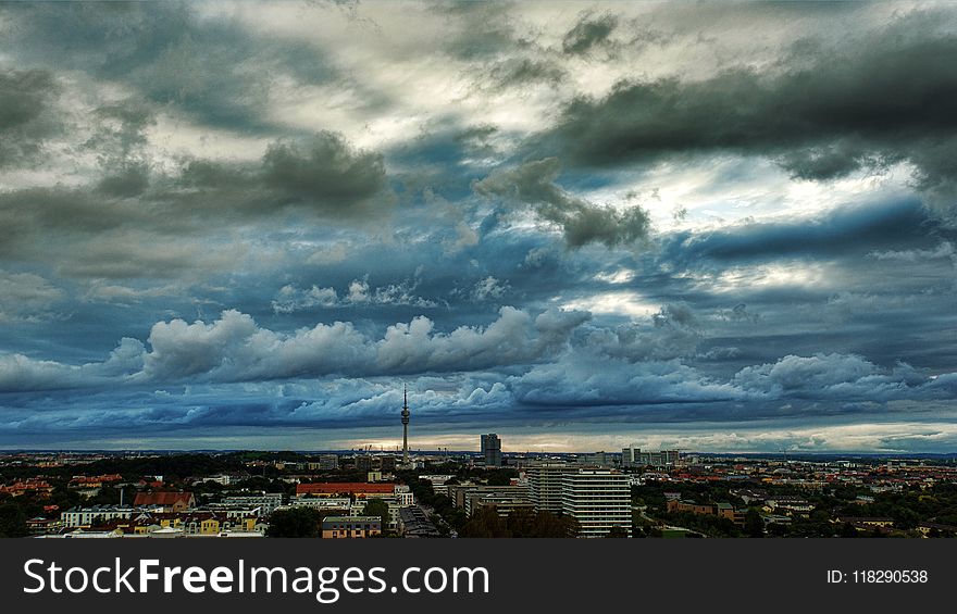 Photography of the City under Cloudy Skies
