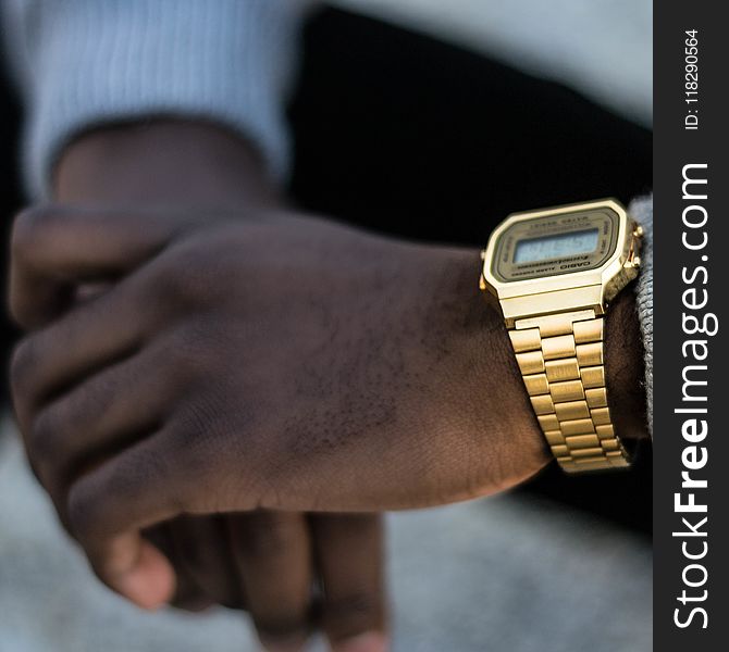 Person Wearing Gold-colored Casio Digital Watch With Linked Strap