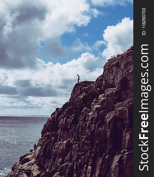 Person Standing On Cliff