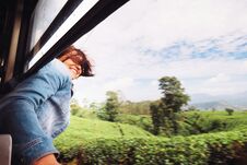 Happy Woman Looks Out From Train Window During Traveling On Most Stock Image