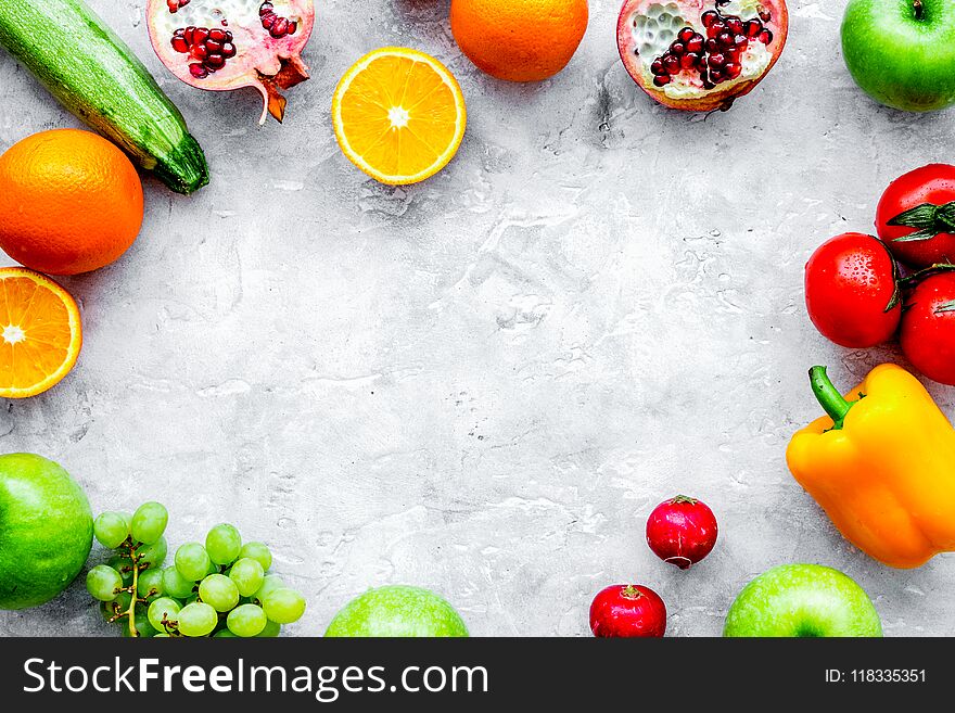 Fresh vegetables and fruits for fitness dinner on stone desk background top view mockup. Fresh vegetables and fruits for fitness dinner on stone desk background top view mockup