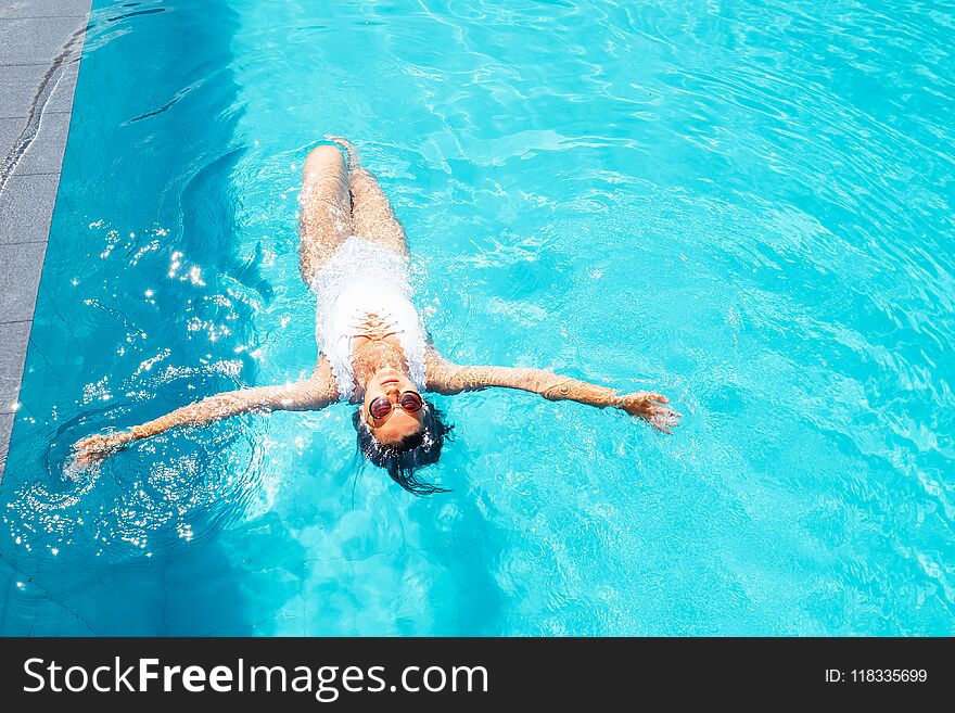 Woman Relax In Swimming Pool