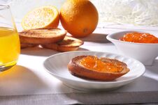 Morning Breakfast Set With Orange Jam On Bread Toast And Juice In Glass. Royalty Free Stock Image