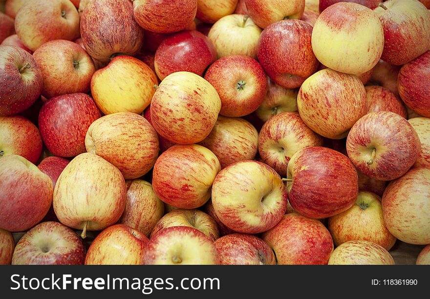 Fresh apples spread out an even layer as a background..