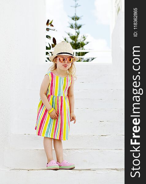 Caucasian Little Blond Girl Walking Tropical Garden