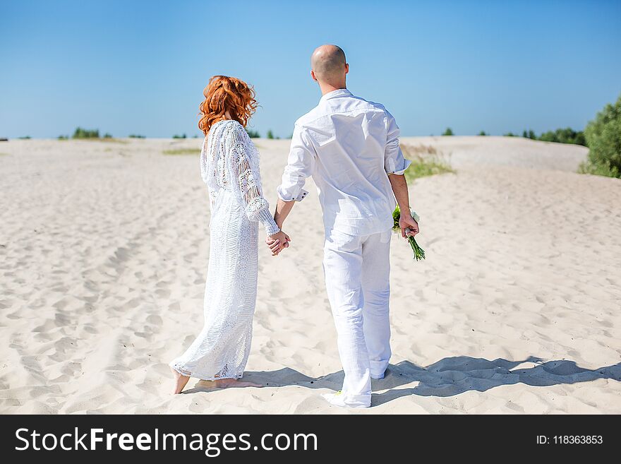 Wedding day. Happy young couple in love. Bride and groom on the beach. Wedding day. Happy young couple in love. Bride and groom on the beach