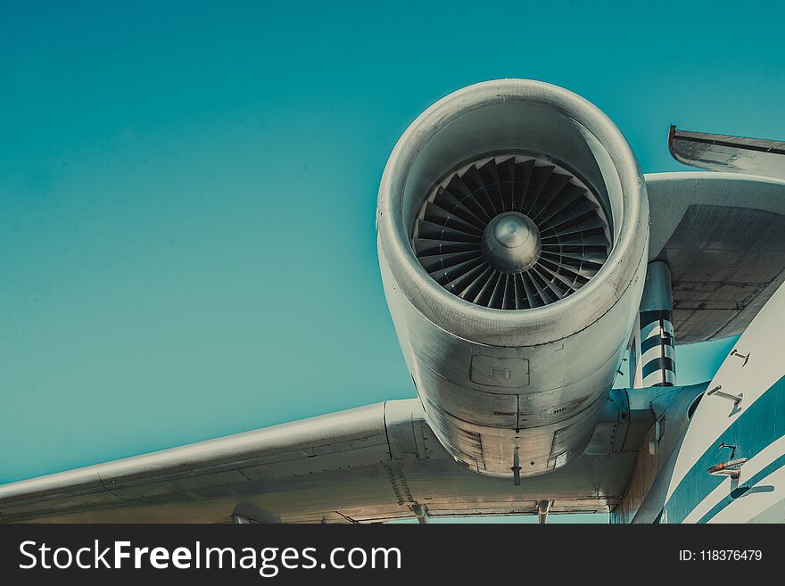 Beautiful view of an airplane on its part an airpcraft engine on a sky background