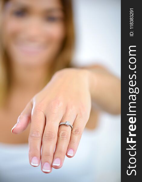Woman showing engagement ring