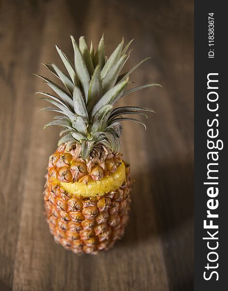 Sliced Pineapple Fruit on a Wooden Table Top