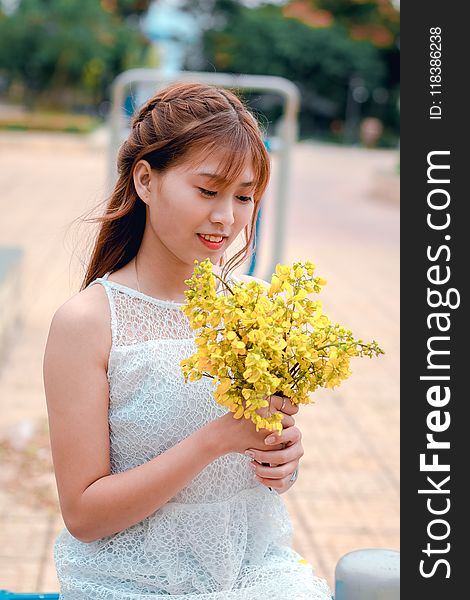 Woman Holding Yellow Petaled Flower Bouquet