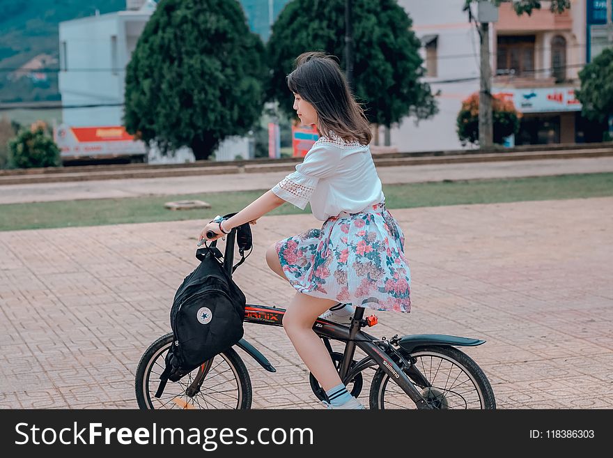 Woman Riding on Bike