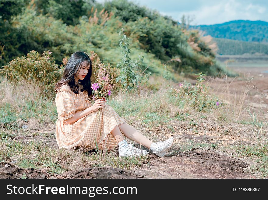 Woman In Brown Dress Under Sunny Sky