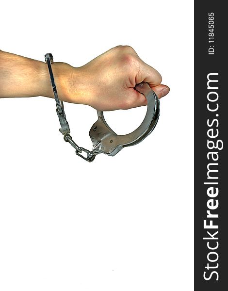 A hand is handcuffed on white background. A hand is handcuffed on white background