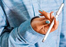 Woman In Blue Shirt Hold Pen In Your Hand. Pen Spinning Royalty Free Stock Images