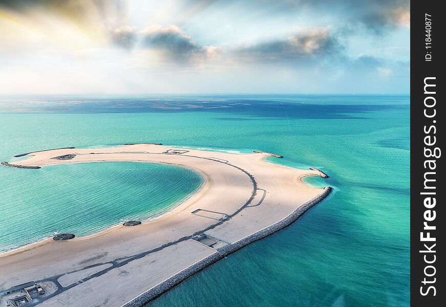 Piece Of Sand In The Ocean. Beach And Water, Aerial View