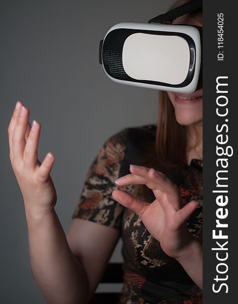 Girl in a virtual reality head set over green