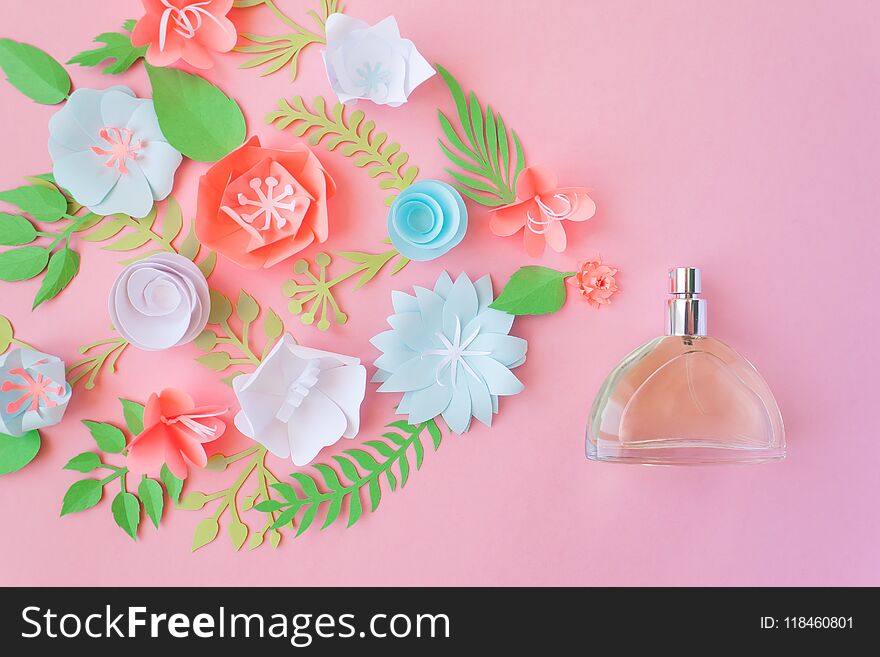 Flower arrangement. Flowers, fragrance, perfume on pink background. Cut from paper