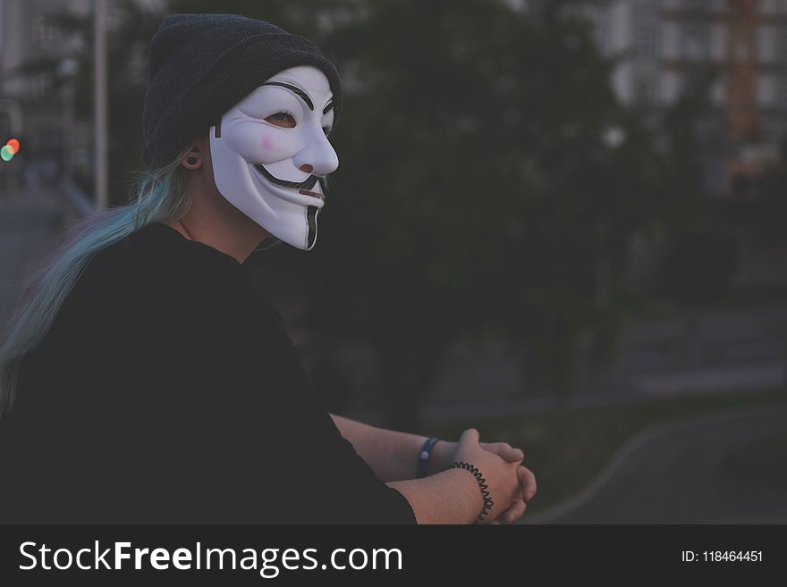 Woman Wearing White Guy Fawkes Mask