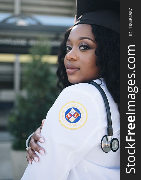 Woman Wearing White Long-sleeved Shirt And Stethoscope