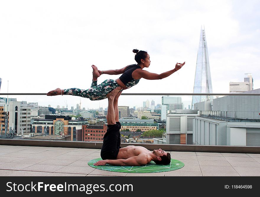 Man And Woman Doing Yoga