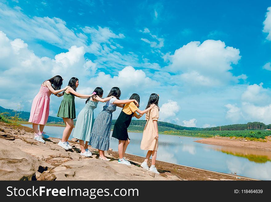 Six Women Standing Near Body Of Water