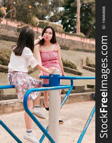 Two Woman On Mary Go Round