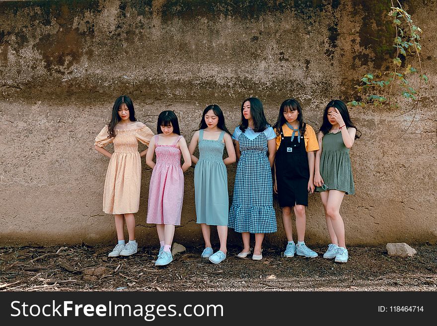 Six Girls Leaning on Wall