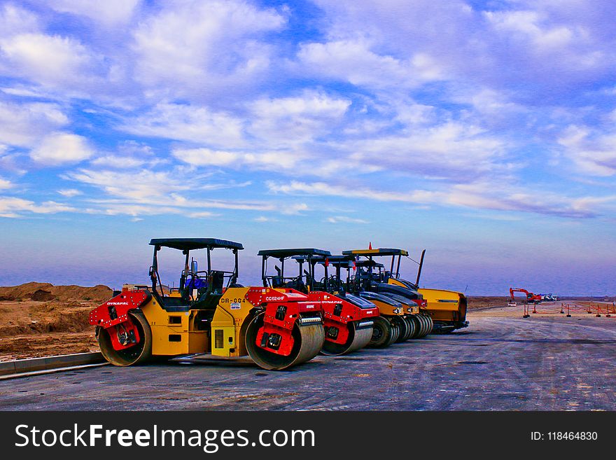 Red and Yellow Heavy Equipment at Daytime