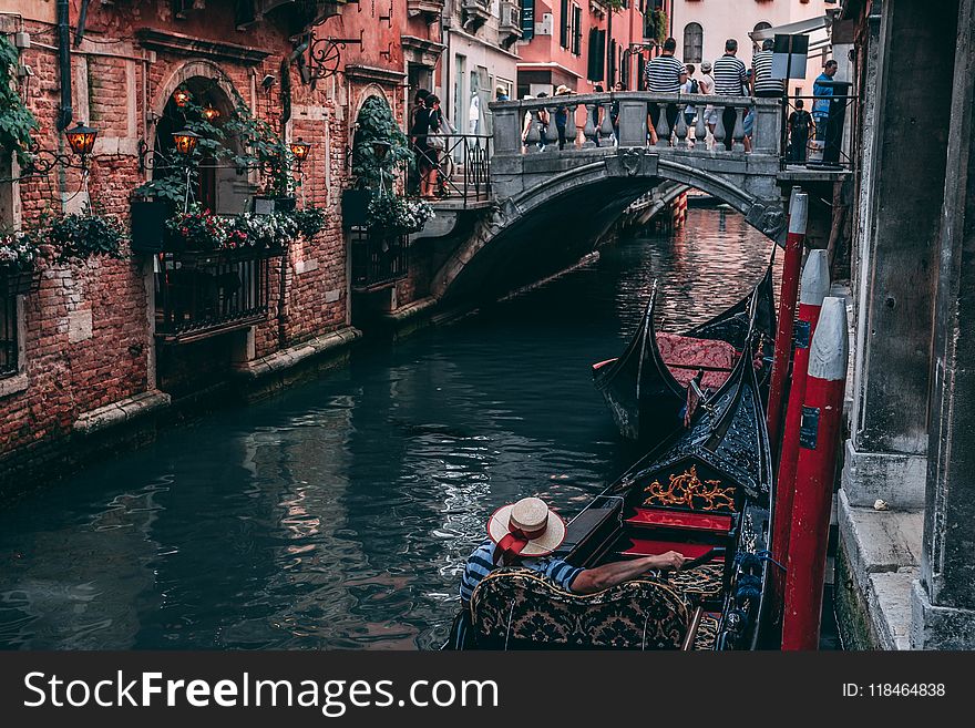 Photo Of Man Riding Canoe