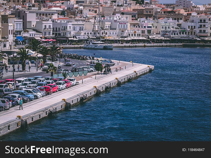 Cars Parked Near Body Of Water